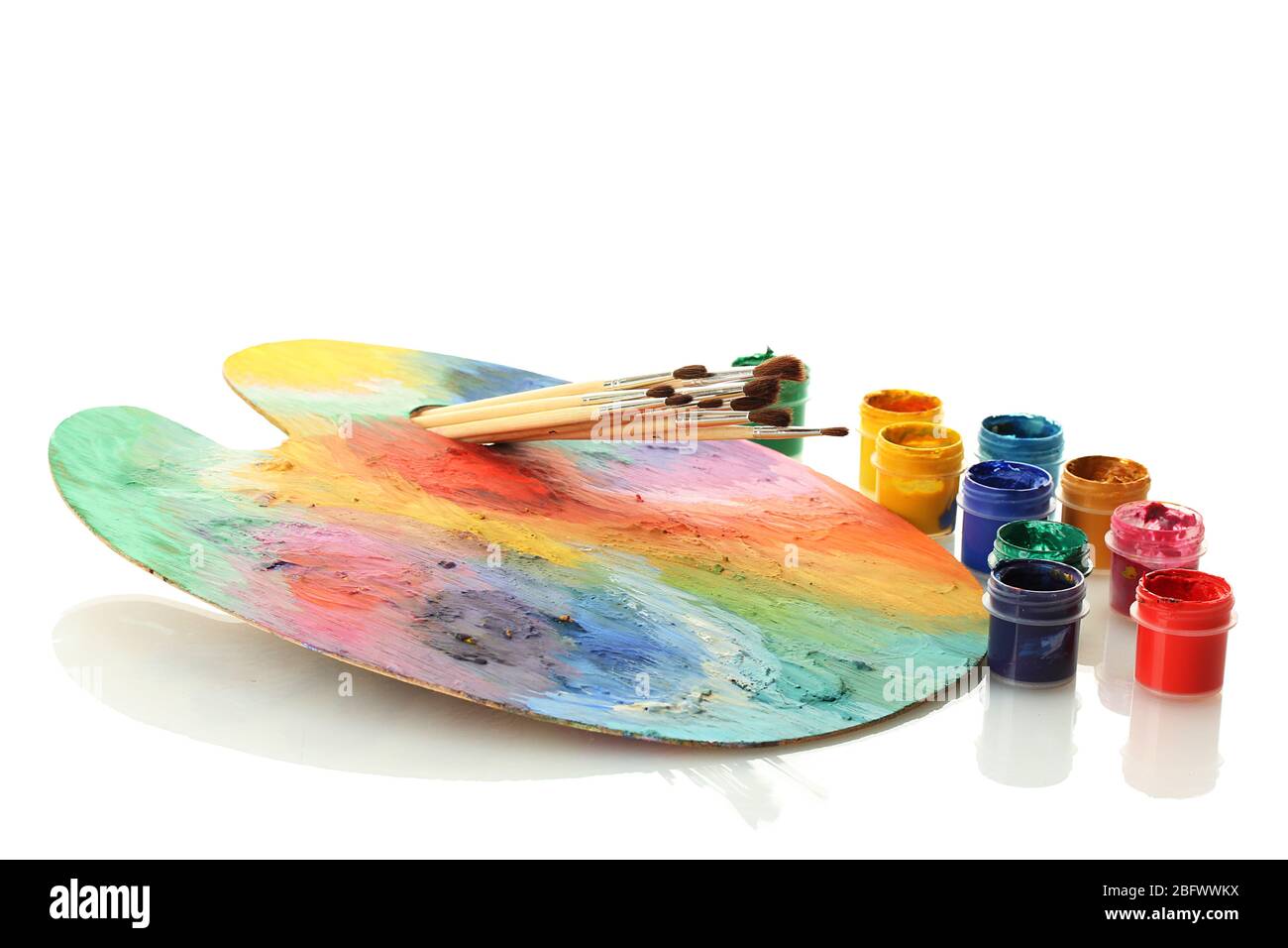 wooden art palette with paint and brushes isolated on white Stock Photo ...
