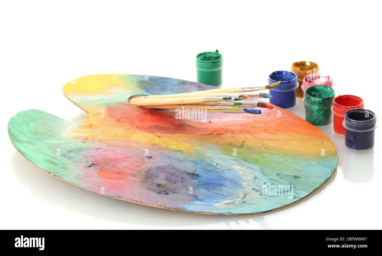 wooden art palette with paint and brushes isolated on white Stock Photo ...