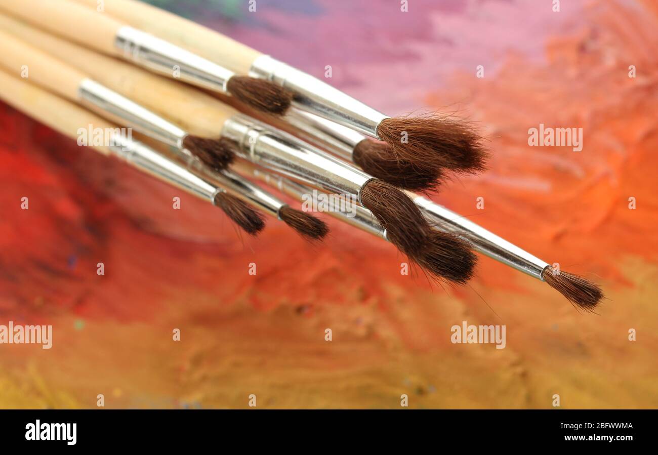 acrylic paint and brushes on wooden palette Stock Photo Alamy