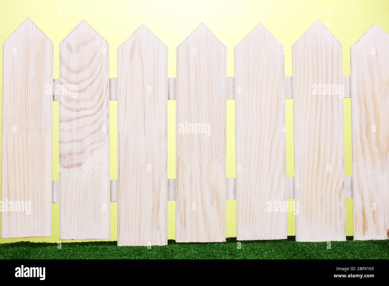 wooden fence and green grass on green background Stock Photo - Alamy