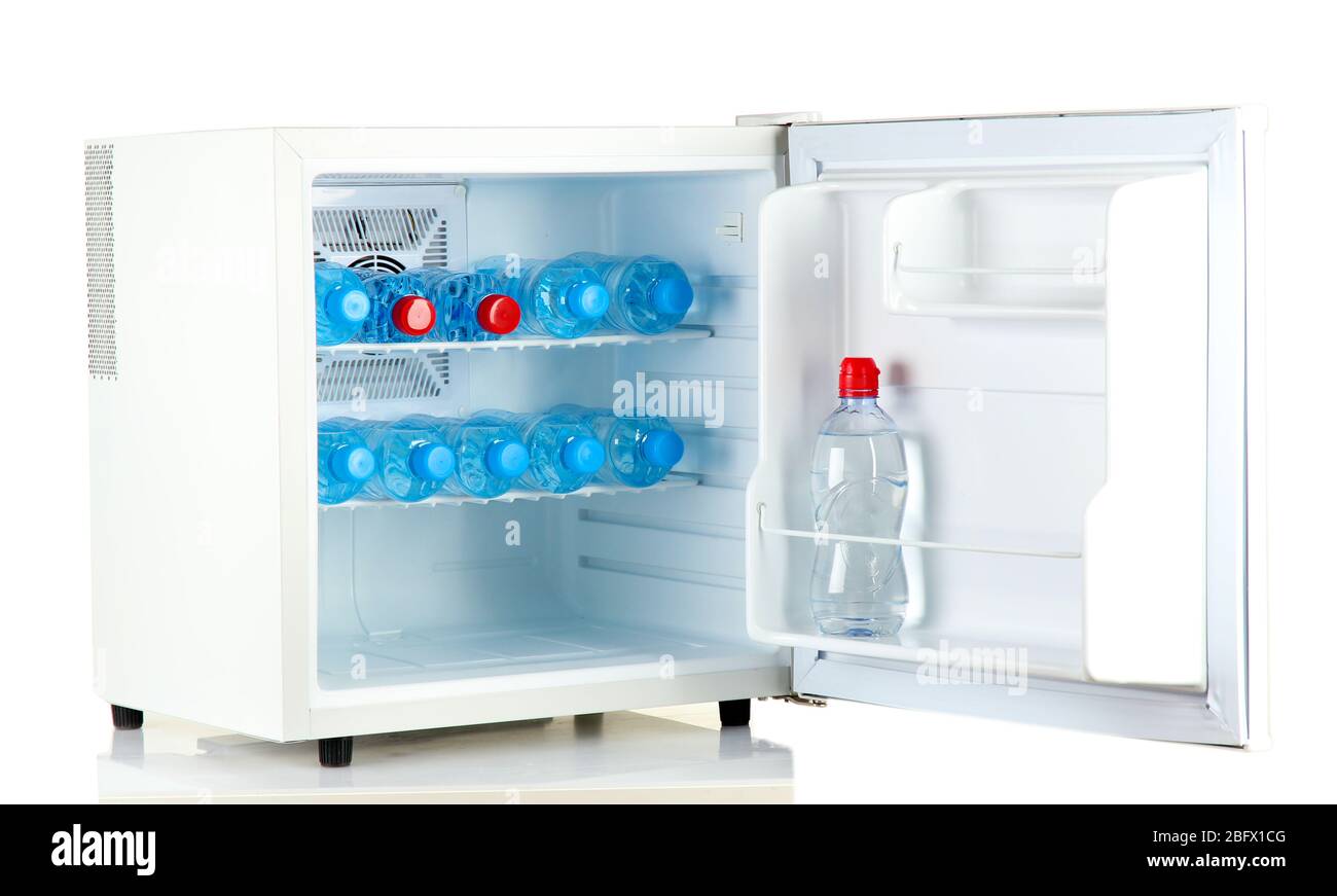 mini fridge full of bottled water isolated on white Stock Photo - Alamy