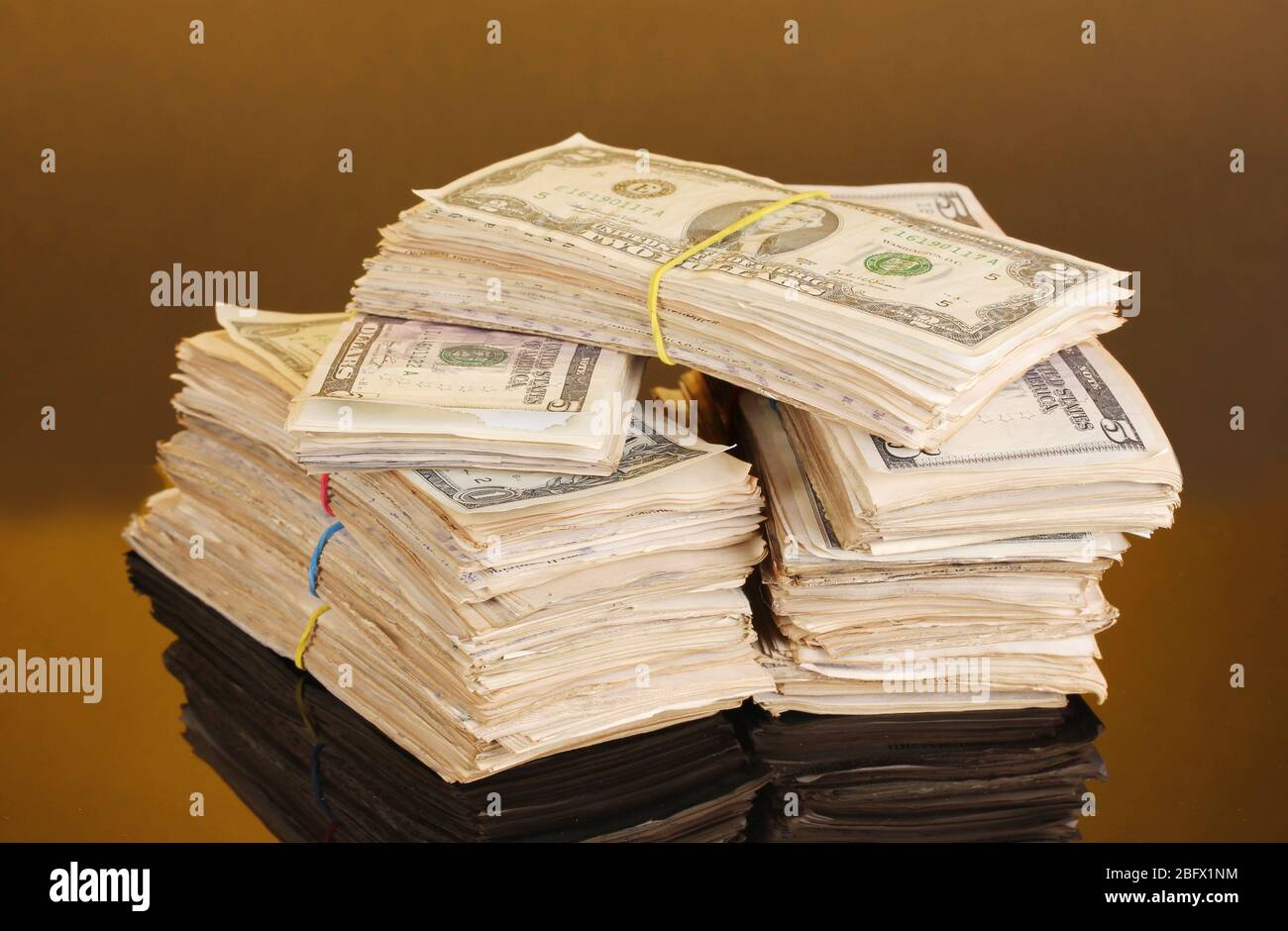 Orange Cash Stack Stacks of dollars on orange background Stock Photo - Alamy