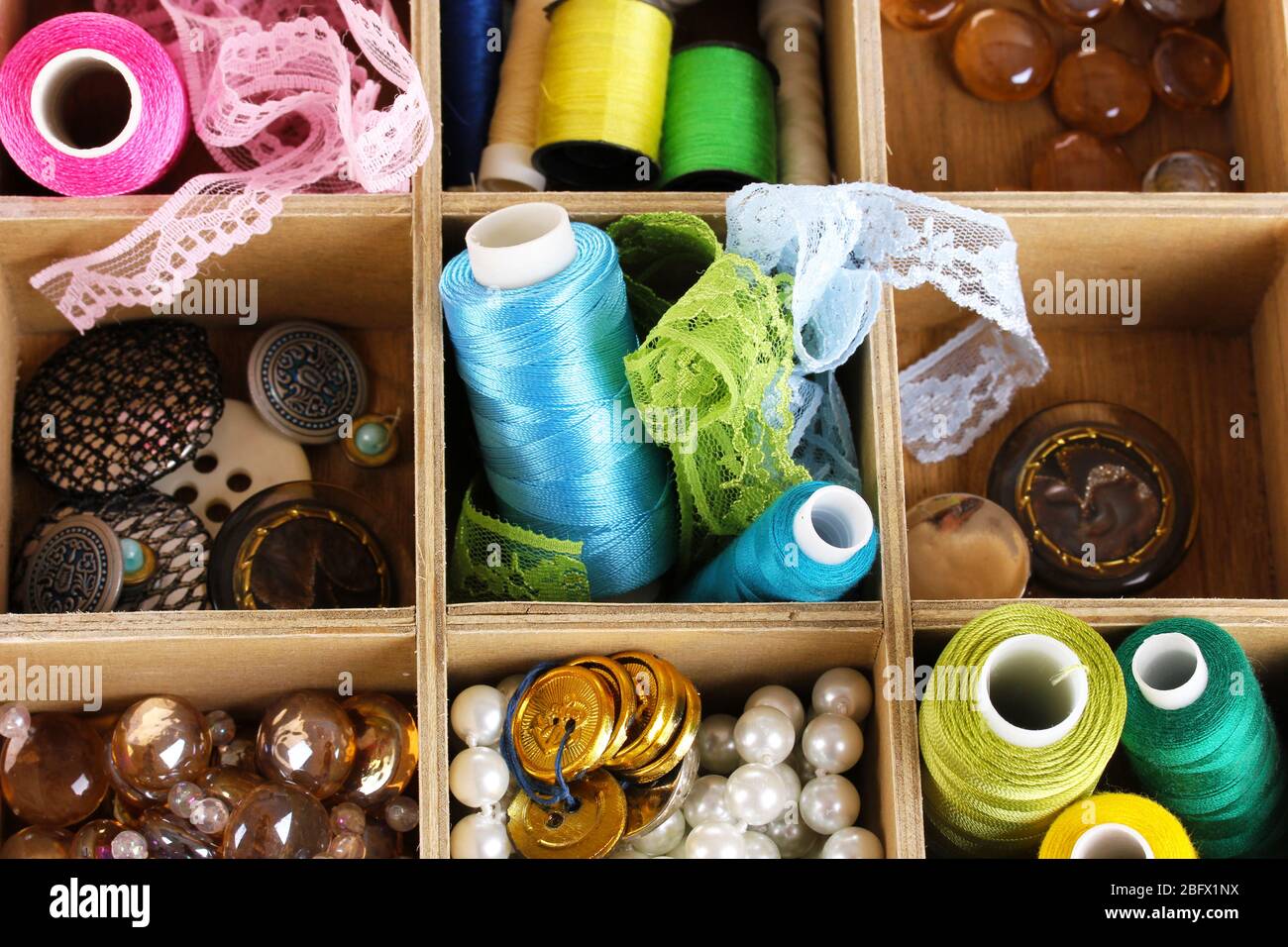 thread and material for handicrafts in box close-up Stock Photo