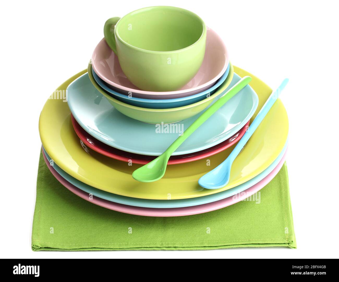 Colorful plates on napkin isolated on white Stock Photo Alamy