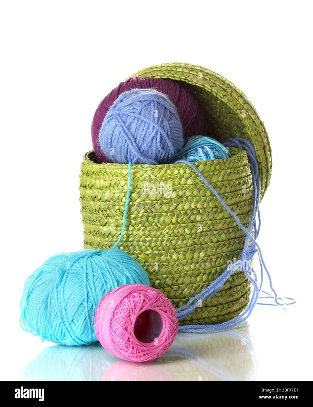 Colorful yarn for knitting in green basket isolated on white Stock ...