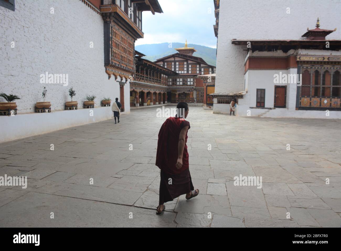 Paro Inside A young monk walks inside Rinpung Dzong, the main monastery and ...