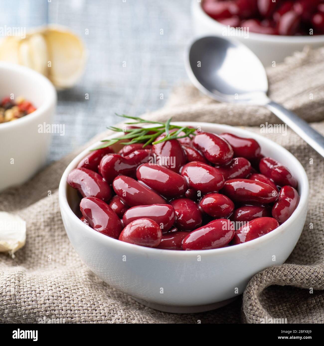 Canned red kidney beans in white bowl on a table Stock Photo