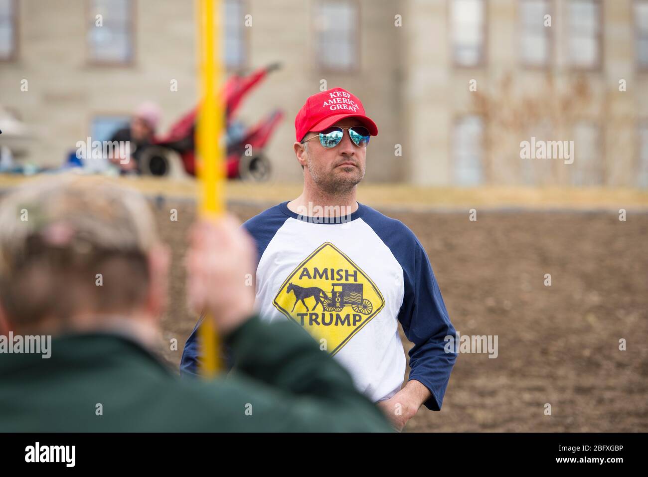 Helena, Montana - April 19, 2020: Man wearing a red Keep America Great hat at a protest over the government shutdown due to the Covid-19 Coronavirus p Stock Photo