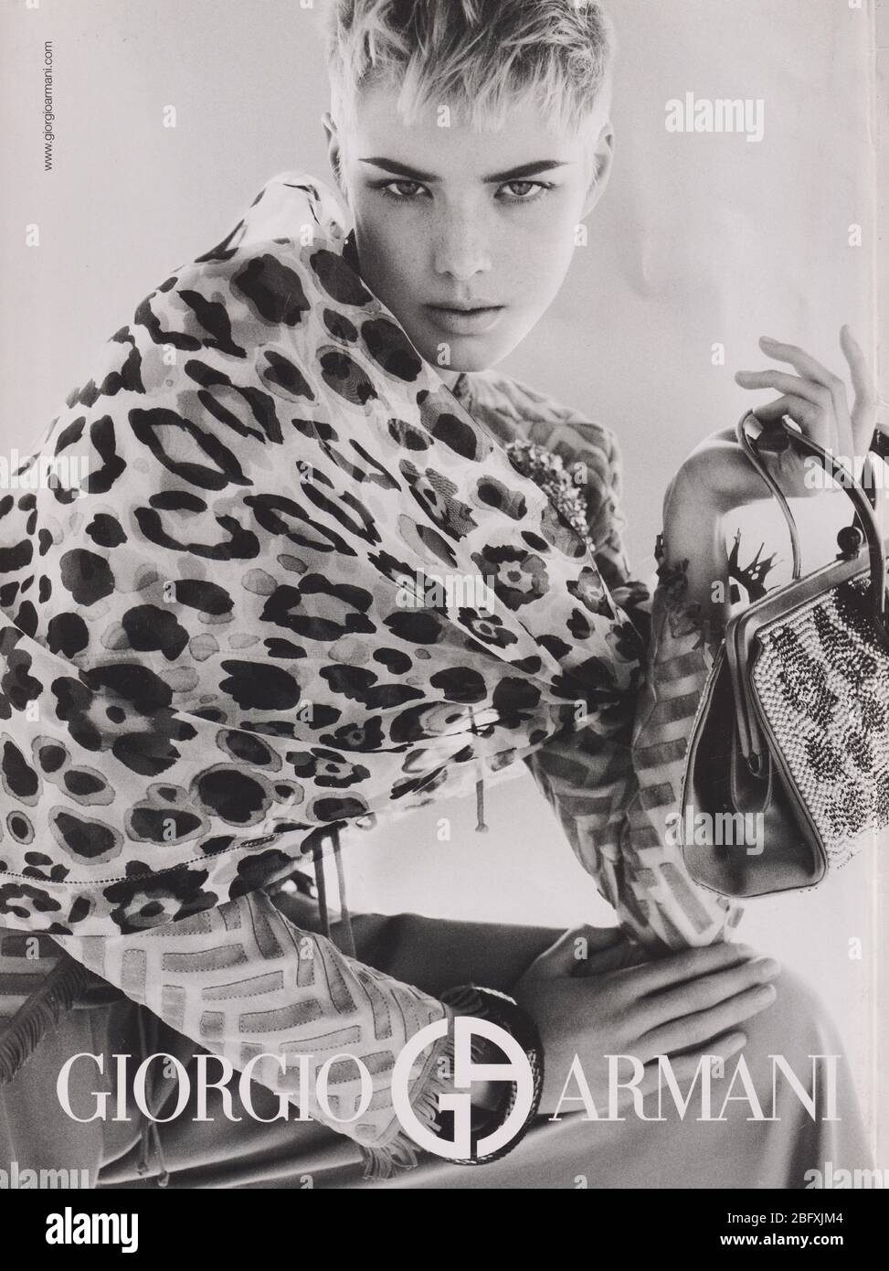 poster advertising Giorgio Armani with Agyness Deyn in paper magazine from 2007 year, advertisement, creative Giorgio Armani advert from 2000s Stock Photo