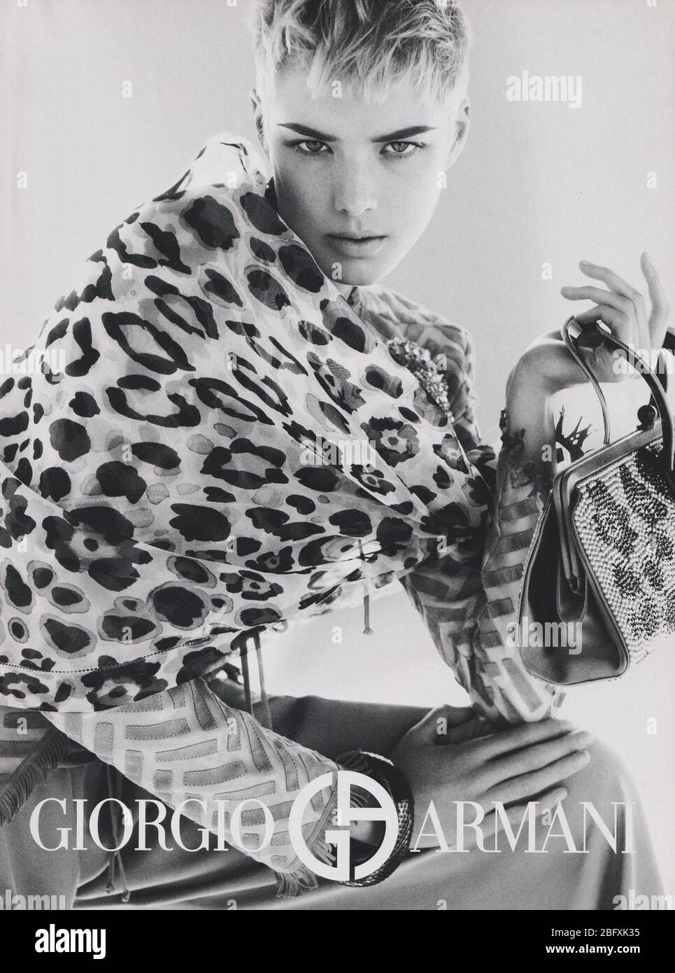 poster advertising Giorgio Armani with Agyness Deyn in paper