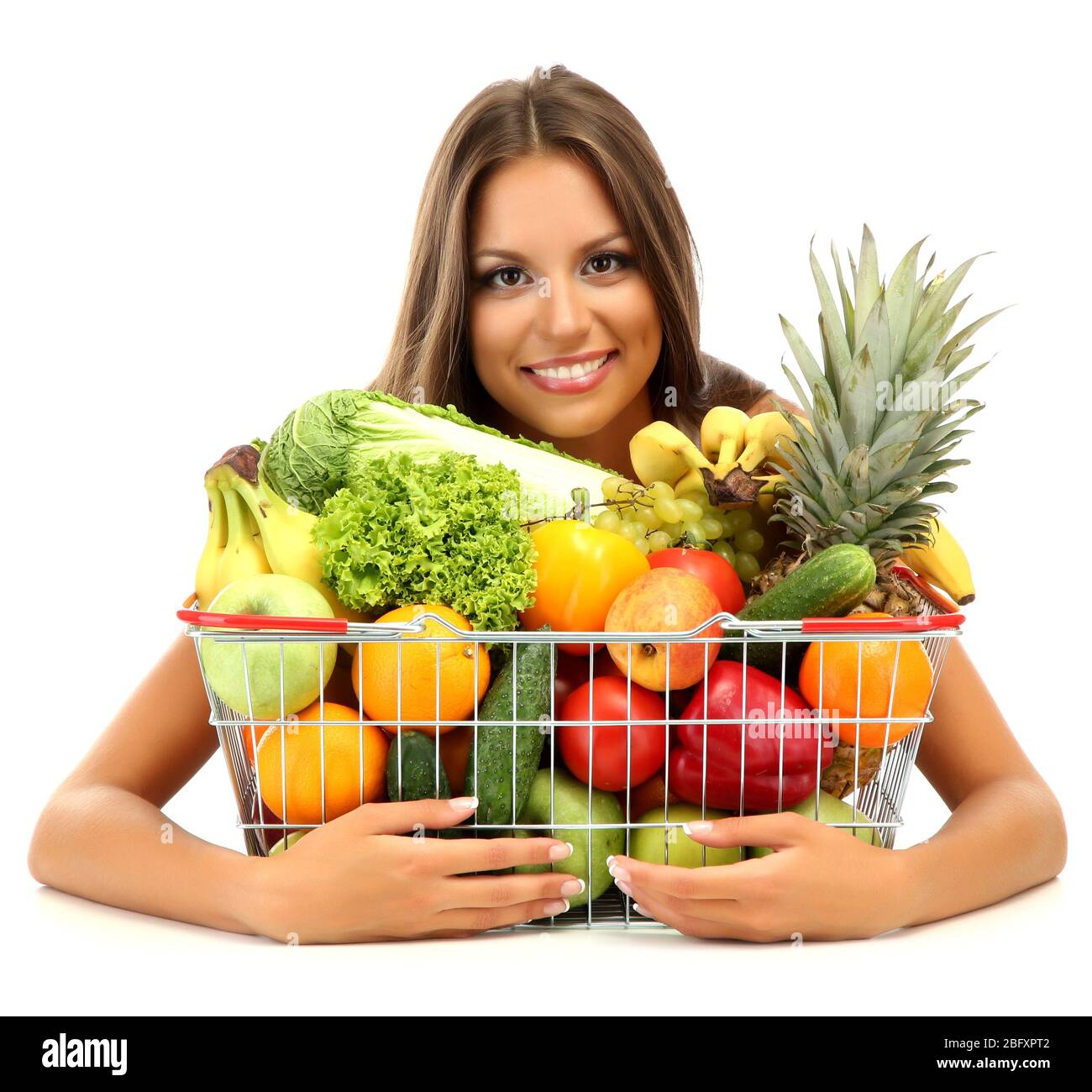 beautiful young woman with fruits and vegetables in shopping basket ...