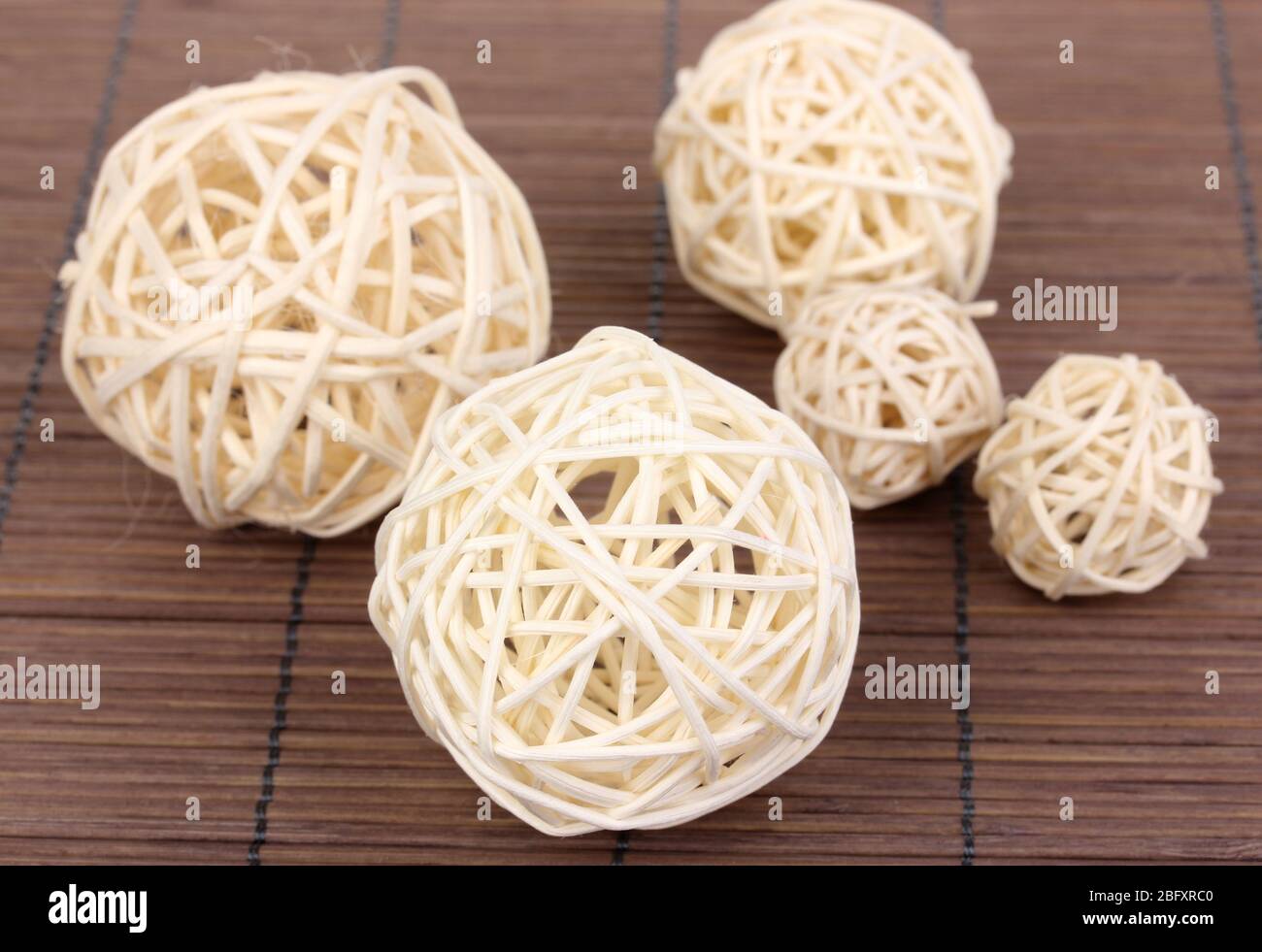 https://c8.alamy.com/comp/2BFXRC0/wicker-bamboo-balls-on-bamboo-mat-2BFXRC0.jpg