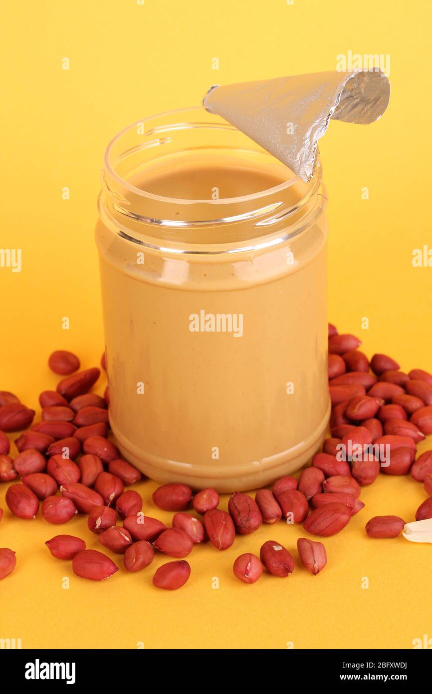 Download Delicious Peanut Butter In Open Jar Of Peanut Near On Yellow Background Stock Photo Alamy PSD Mockup Templates
