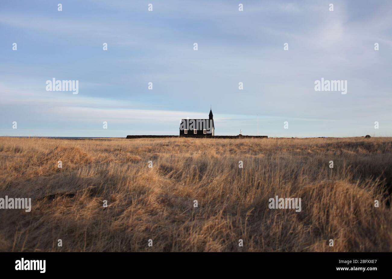 Black church in minimalist landscape Stock Photo