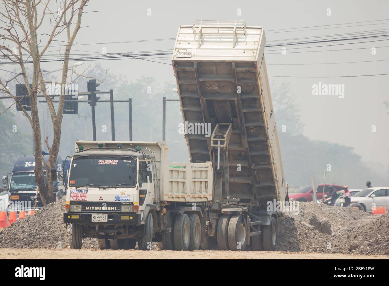 Chiangmai, Thailand -  April 4 2020: Private Mitsubishi Fuso Dump Truck.  Photo at road no.121 about 8 km from downtown Chiangmai, thailand. Stock Photo