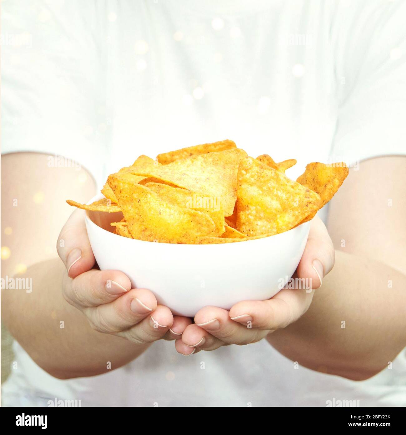 Girl tortilla chip bowl hires stock photography and images Alamy