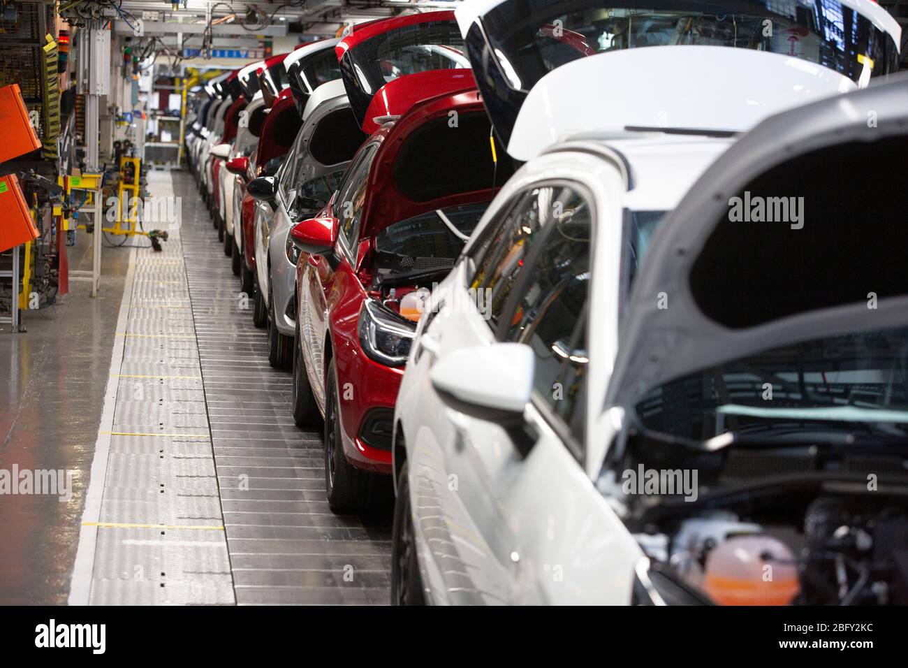 A line of cars on a car assembly line at the Vauxhall car factory during preparedness tests and redesign ahead of re-opening following the COVID-19 outbreak. Located in Ellesmere Port, Wirral, the factory opened in 1962 and currently employs around 1100 workers. It ceased production on 17 March 2020 and will only resume work upon the advice of the UK Government, which will involve stringent physical distancing measures being in place across the site. Stock Photo