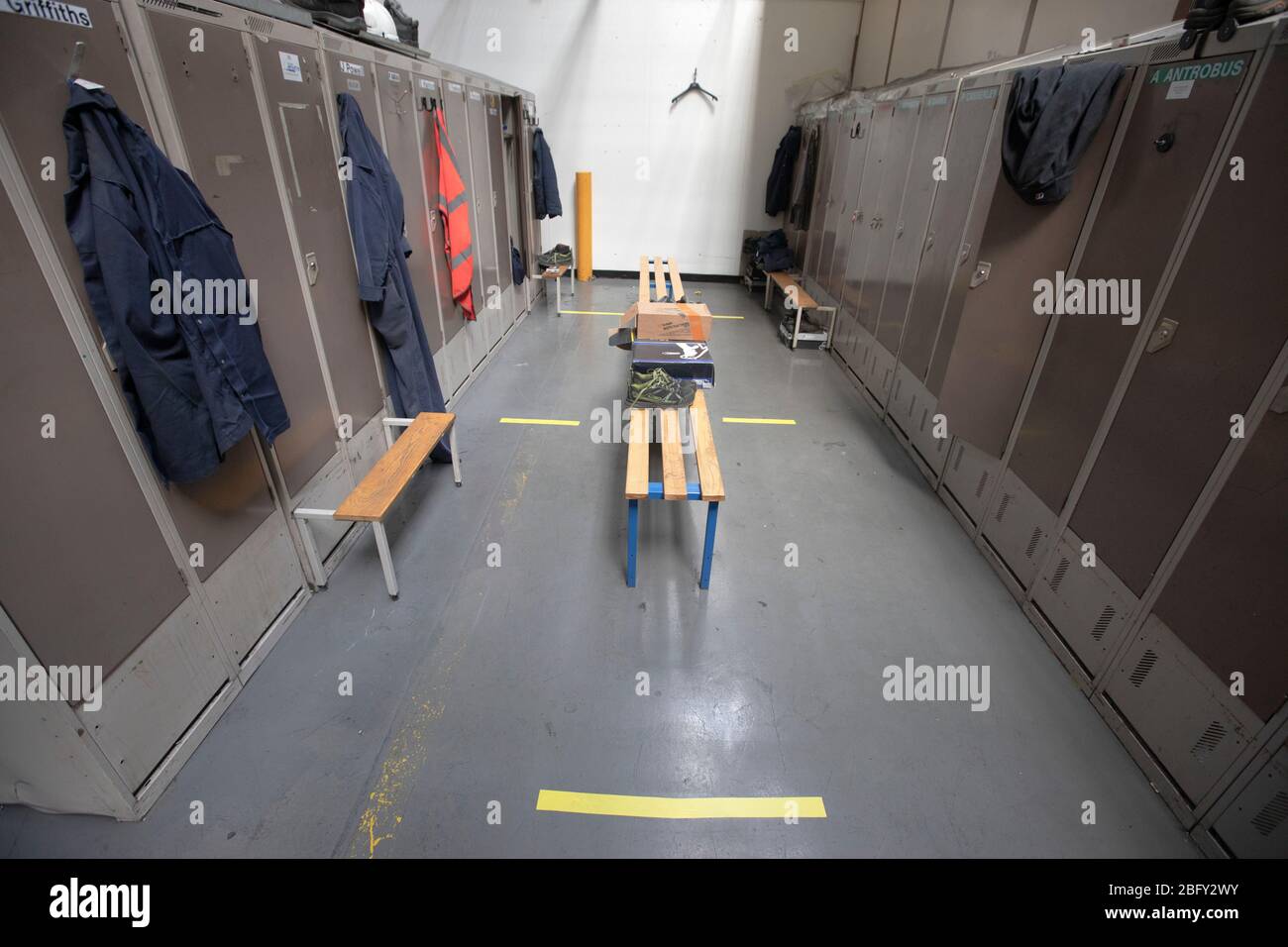 A workers locker room with floor markings at the Vauxhall car factory photographed undergoing preparedness tests and redesign ahead of re-opening following the COVID-19 outbreak. Located in Ellesmere Port, Wirral, the factory opened in 1962 and currently employs around 1100 workers. It ceased production on 17 March 2020 and will only resume work upon the advice of the UK Government, which will involve stringent physical distancing measures being in place across the site. Stock Photo