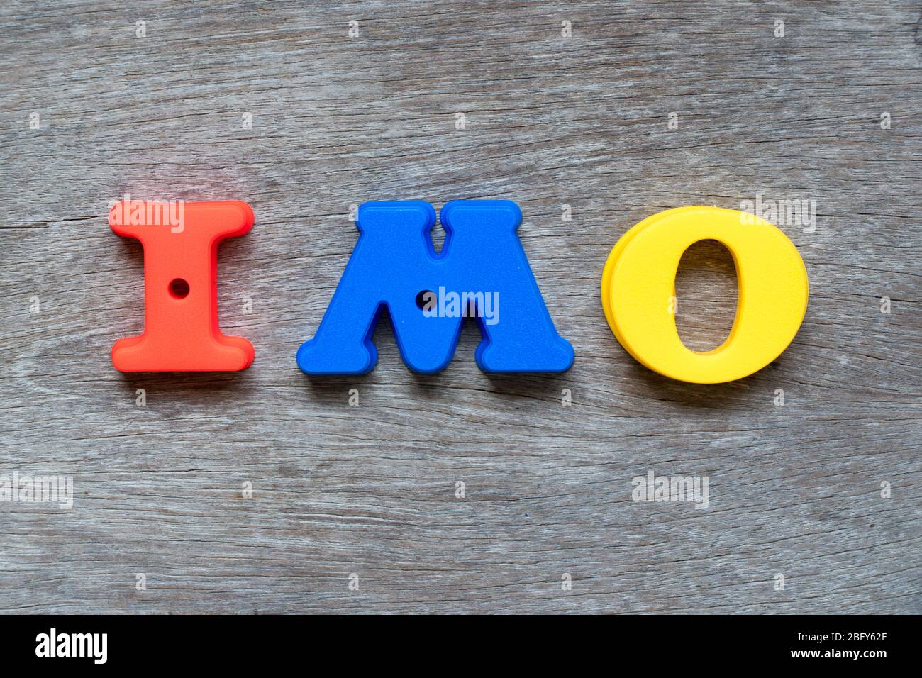 Colorful plastic alphabet in word IMO (Abbreviation of in my opinion