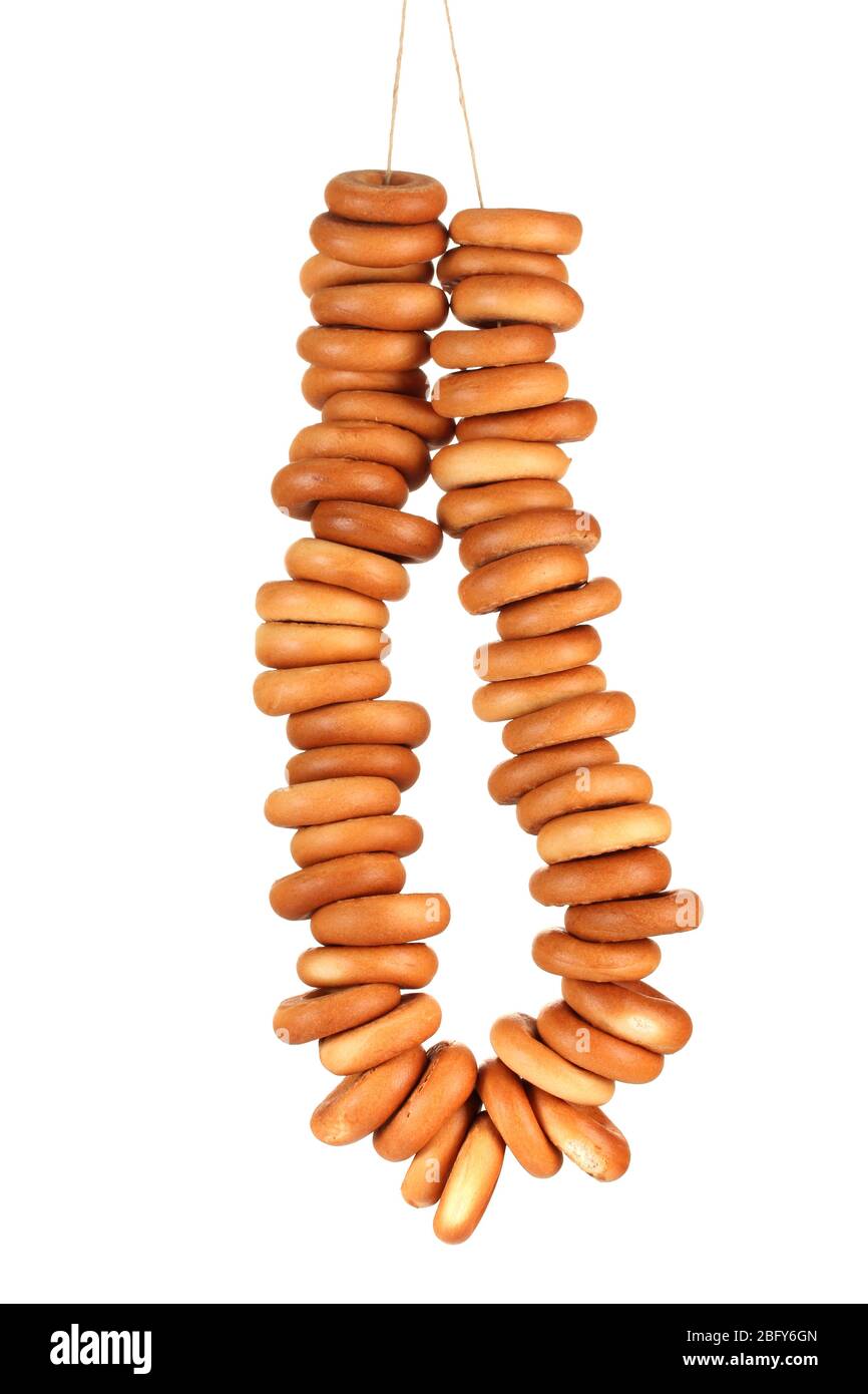 tasty bagels on rope, isolated on white Stock Photo - Alamy