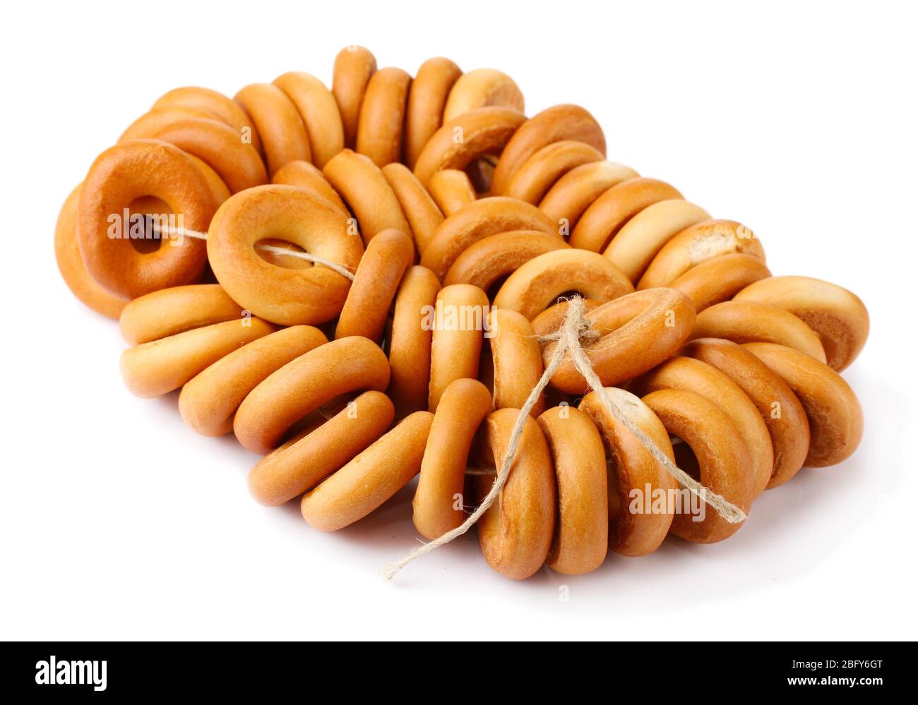 tasty bagels on rope, isolated on white Stock Photo - Alamy