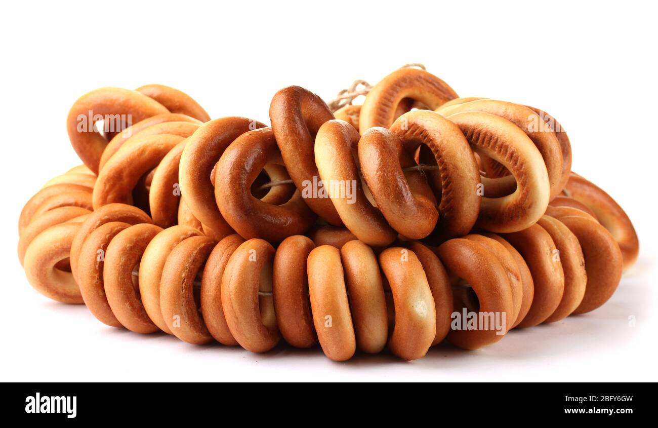 tasty bagels on rope, isolated on white Stock Photo - Alamy