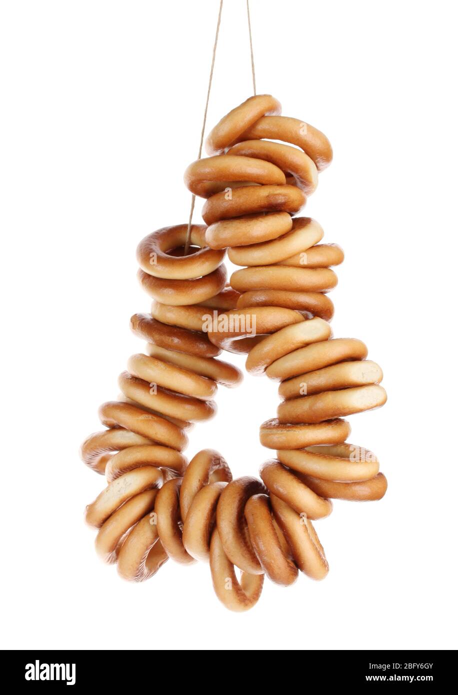tasty bagels on rope, isolated on white Stock Photo - Alamy