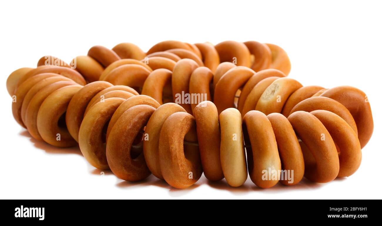 tasty bagels on rope, isolated on white Stock Photo - Alamy