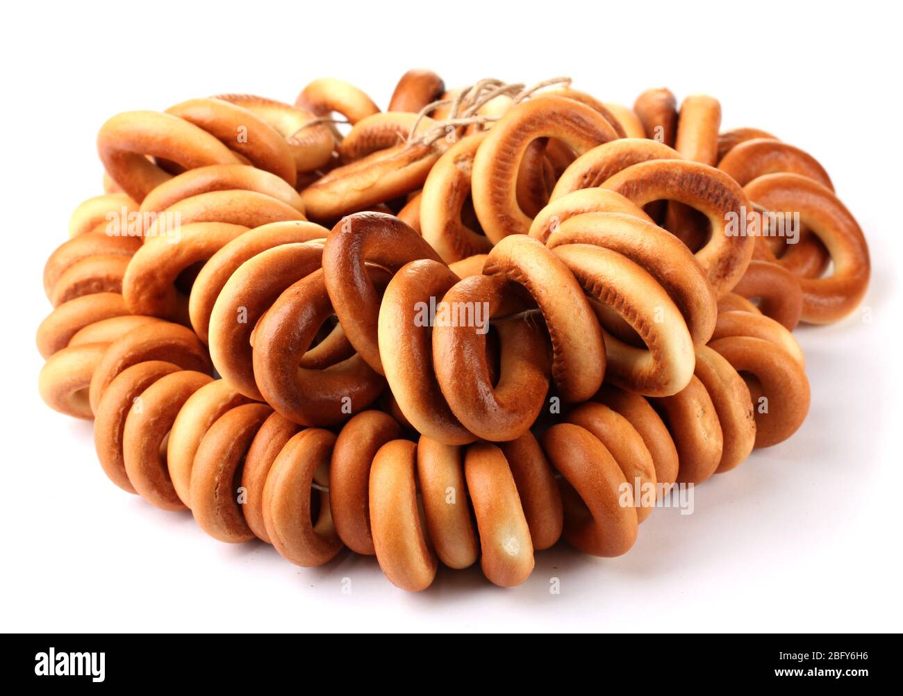 tasty bagels on rope, isolated on white Stock Photo - Alamy