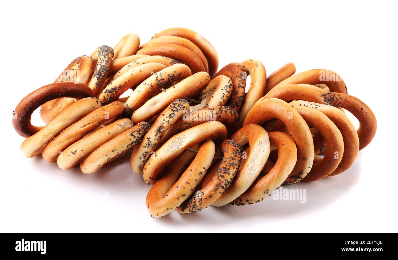 tasty bagels on rope, isolated on white Stock Photo - Alamy
