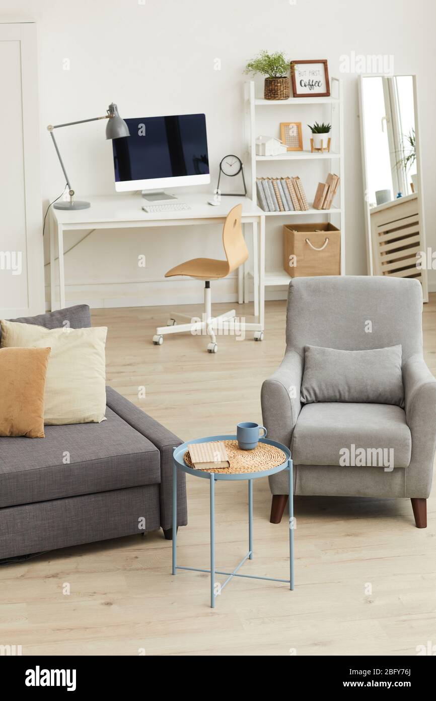 Vertical background image of cozy apartment interior in modern home with  focus on grey living room furniture, copy space Stock Photo - Alamy