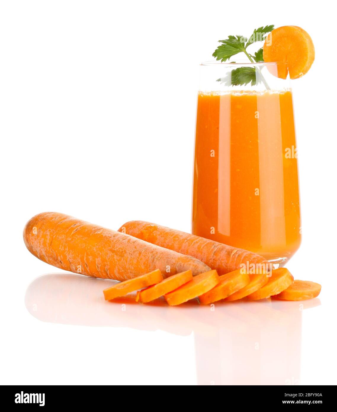 Glass of carrot juice and fresh carrots isolated on white Stock Photo