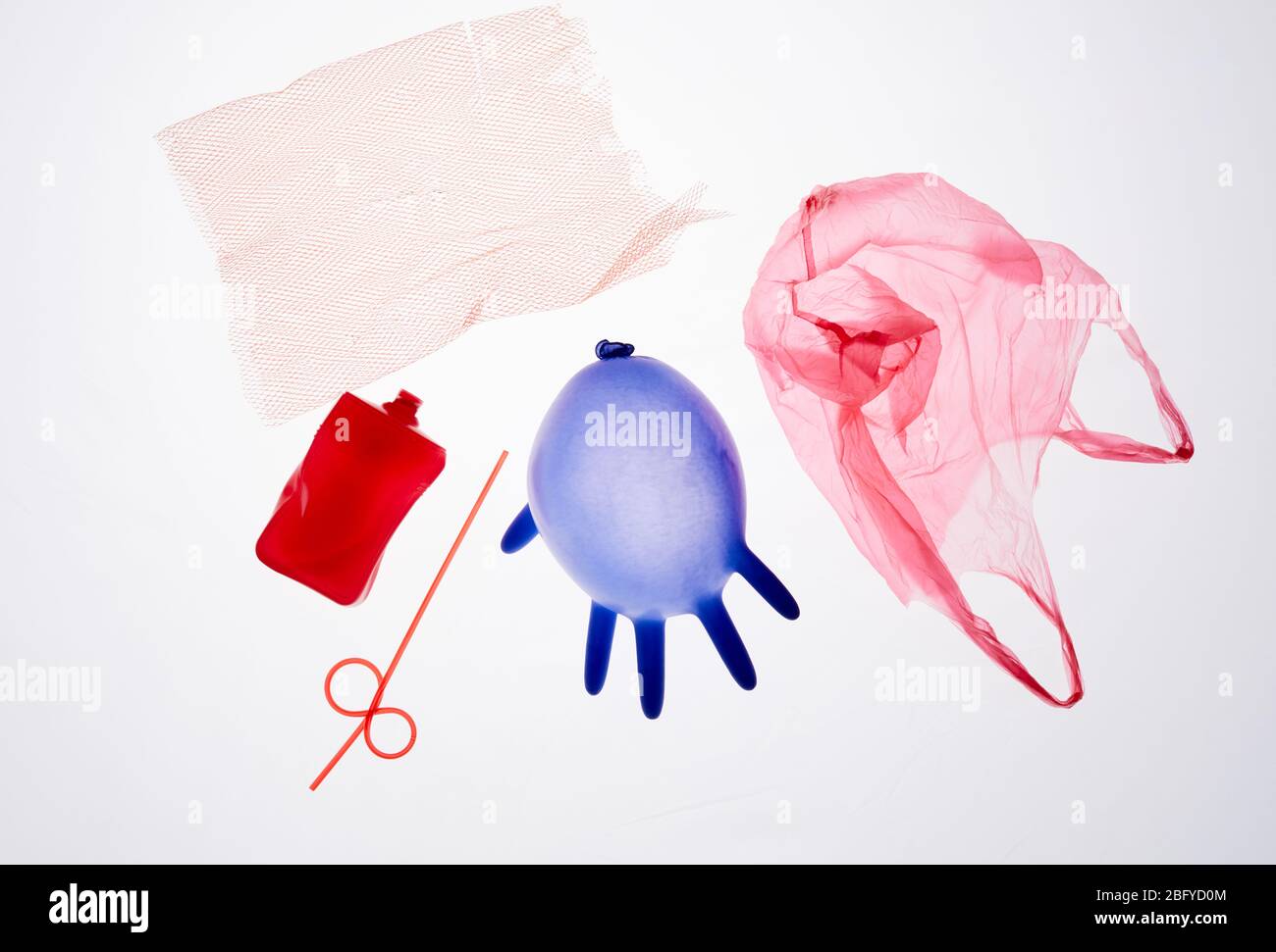 Above view image of plastic medical waste isolated on white backlit