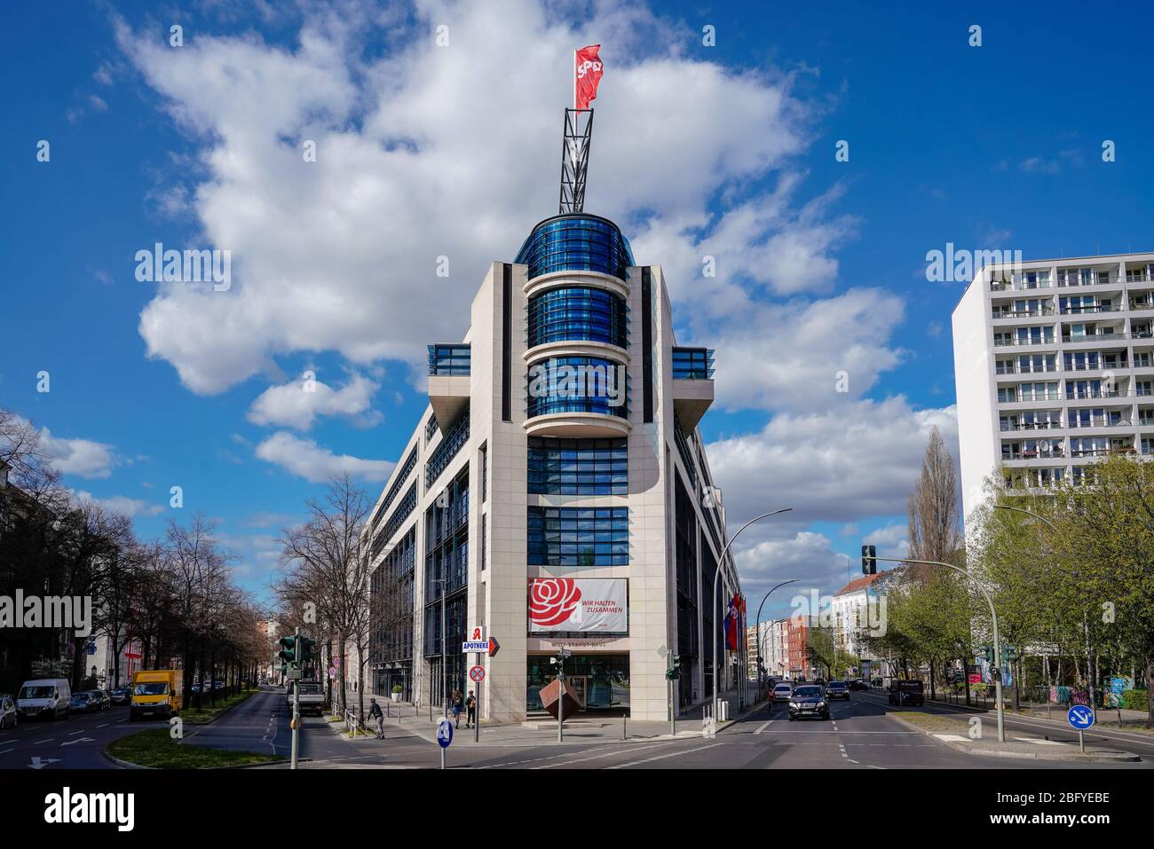 04/09/2020, Berlin, the Willy-Brandt-Haus in Berlin Kreuzberg has been the seat of the federal headquarters of the Social Democratic Party of Germany (SPD) since 1999. The modern house on a sunny afterwithtag in April. On the facade is a banner with the inscription: 'We stick together'. The house is named after Willy Brandt, who was mayor of West Berlin from 1957 to 1966, chairman of the SPD party from 1964 to 1987 and German chancellor from 1969 to 1974. | usage worldwide Stock Photo