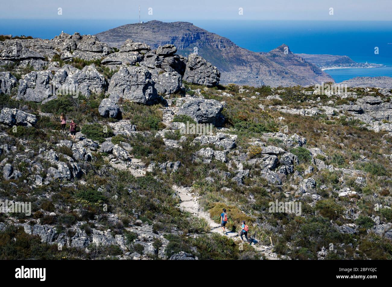 Hikers on top of Table mountain national park trail on hot day. Cape town South Africa Stock Photo