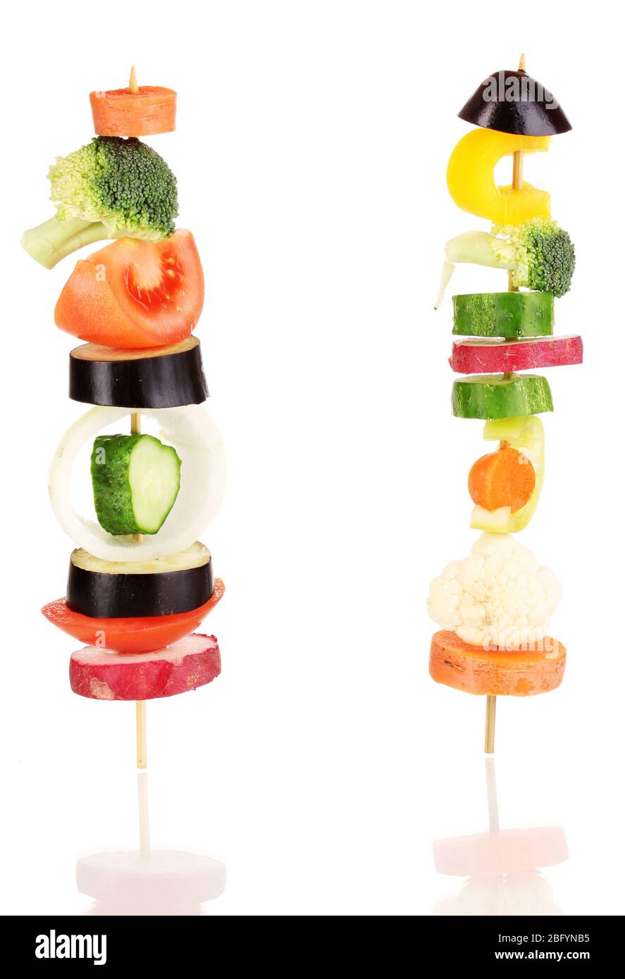 Sliced vegetables on wooden pick isolated on white Stock Photo