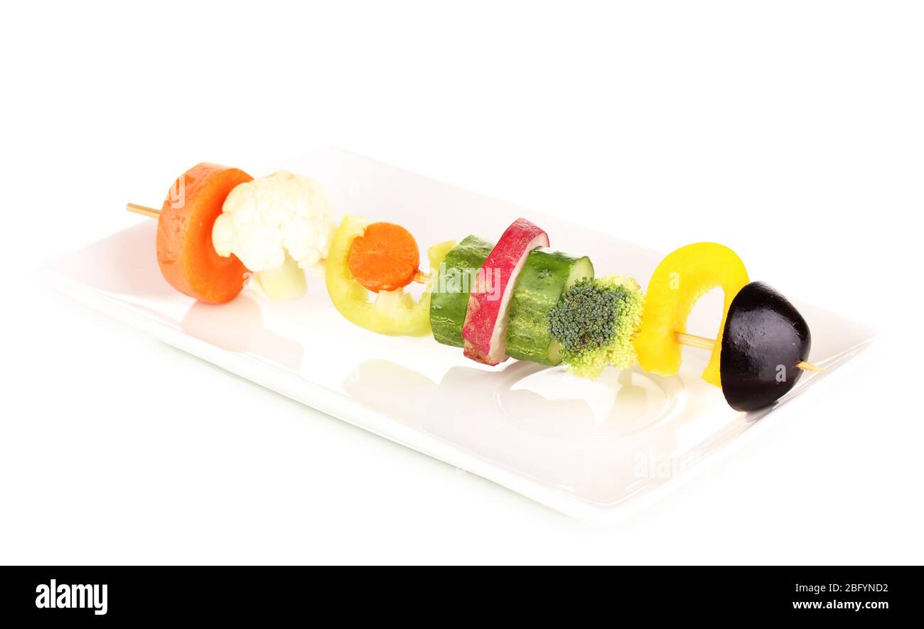 Sliced vegetables on wooden pick isolated on white Stock Photo
