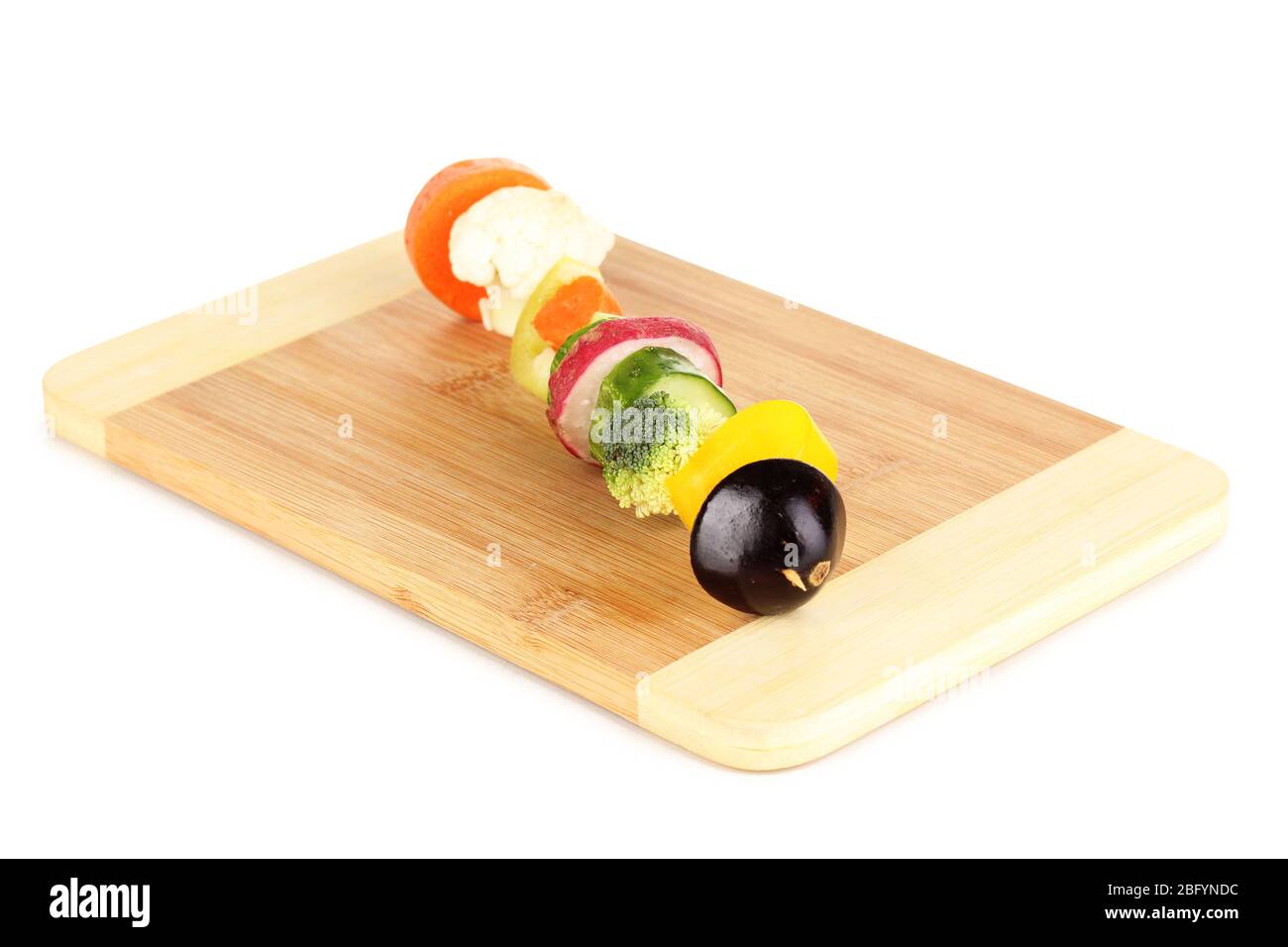 Sliced vegetables on wooden pick isolated on white Stock Photo