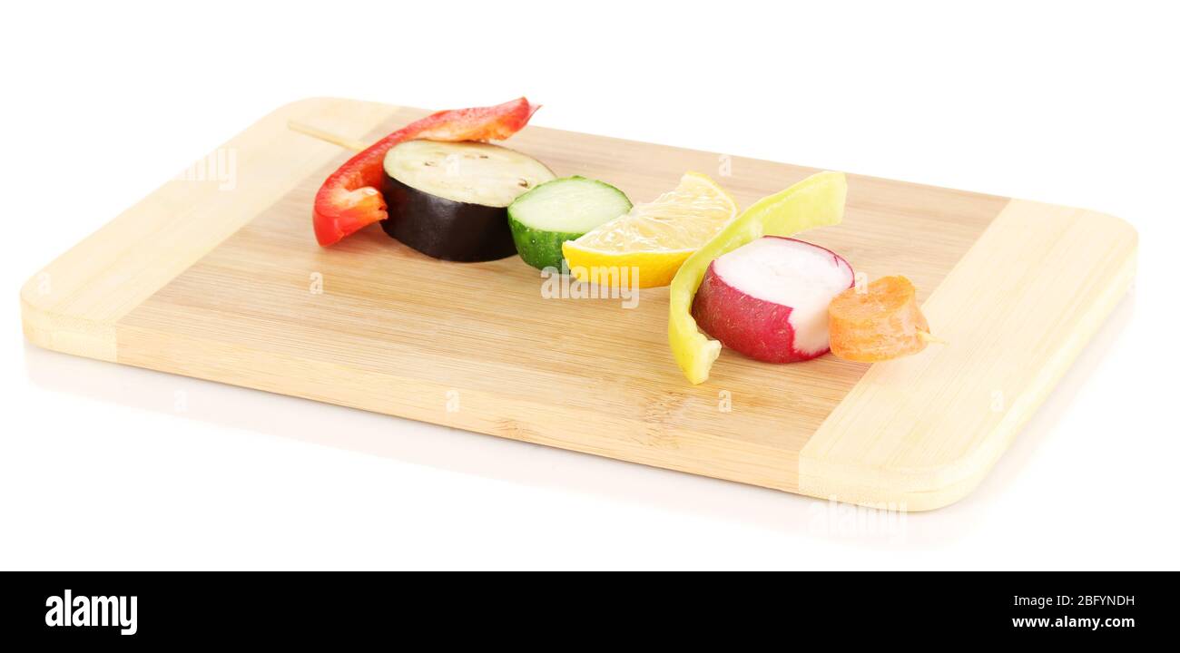 Sliced vegetables on wooden pick isolated on white Stock Photo