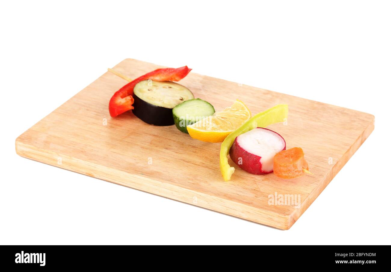 Sliced vegetables on wooden pick isolated on white Stock Photo