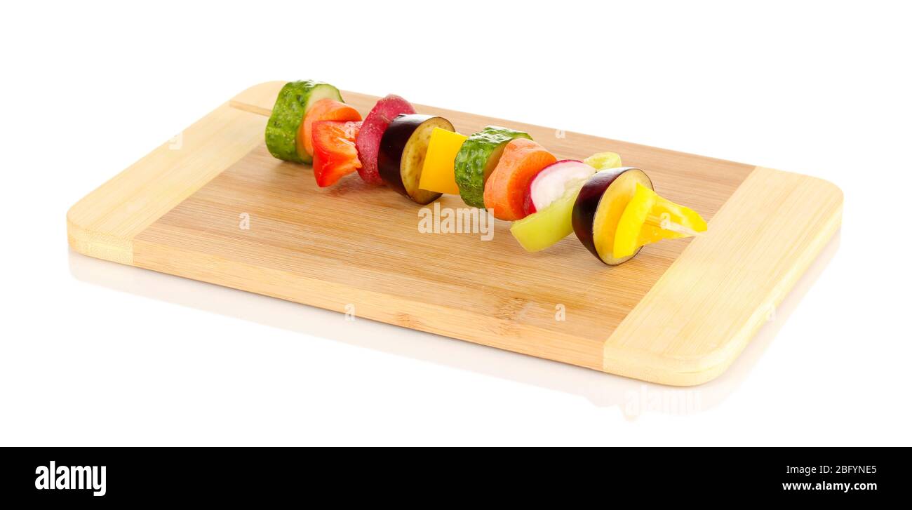 Sliced vegetables on wooden pick isolated on white Stock Photo
