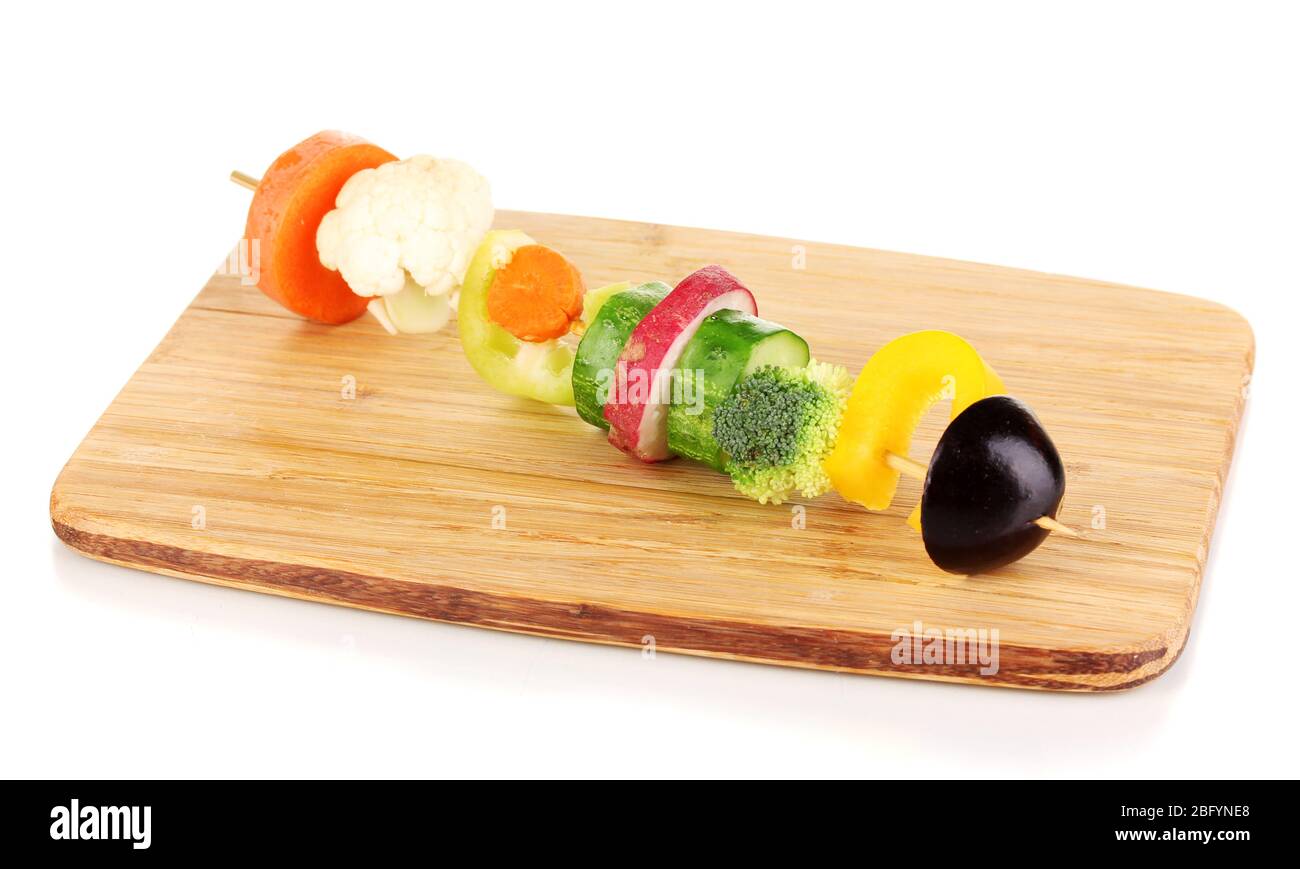 Sliced vegetables on wooden pick isolated on white Stock Photo