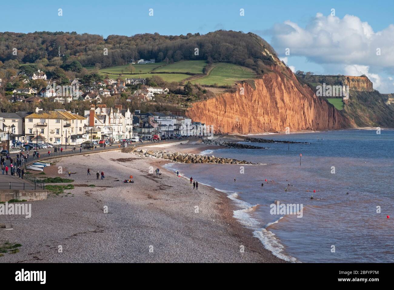 Sidmouth, England - November 7, 2019: The pebbled foreshore is a popular attraction in the Devon town for locals and holidaymakers all the year round Stock Photo