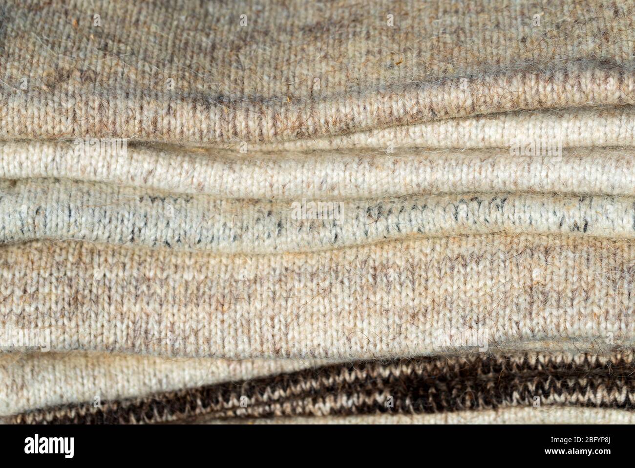 Knitted texture. Pattern fabric made of wool. Stock Photo