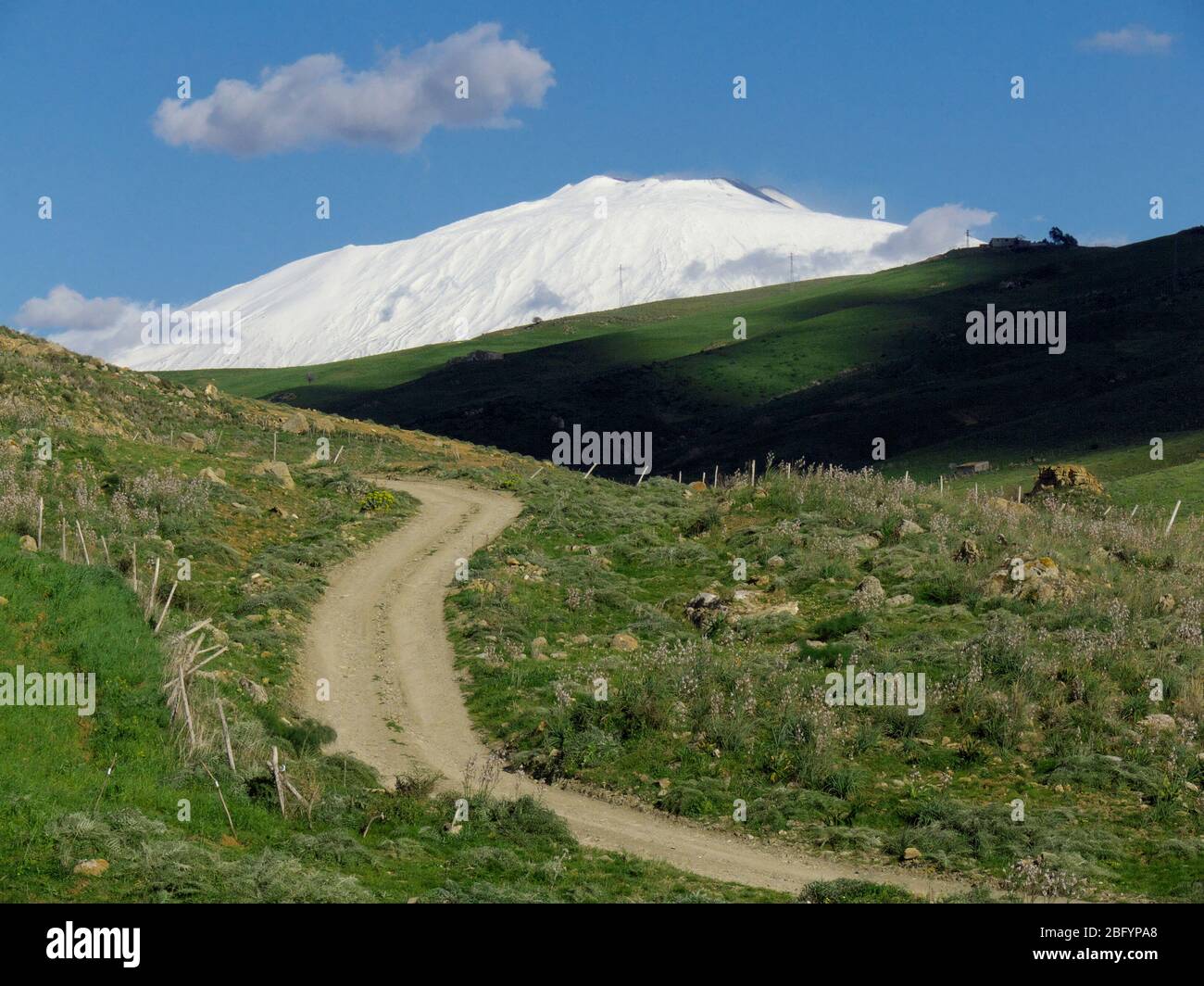 winding rural road to Etna Mount snow covered in Sicily Stock Photo