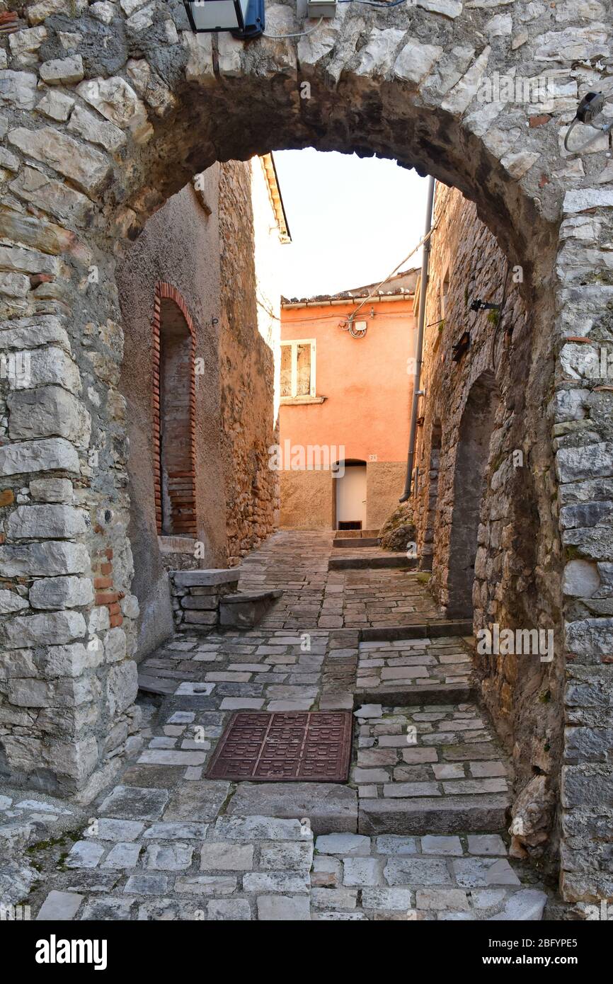 A narrow street between the old houses of the village of Castropignano in the province of Campobasso Stock Photo