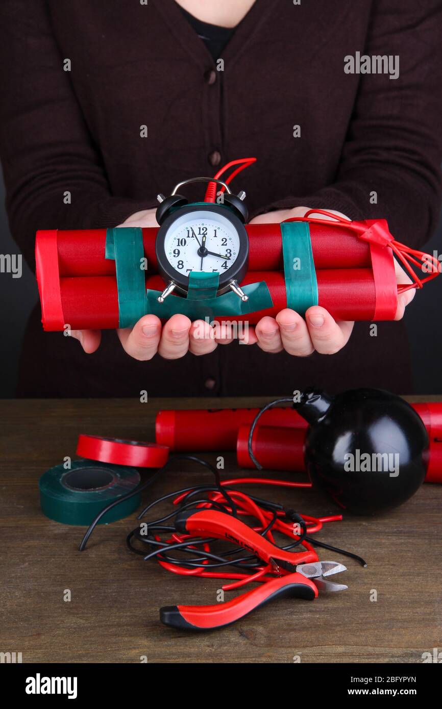 Time Bomb Structure Human makes timebomb on wooden table on black background Stock Photo ...