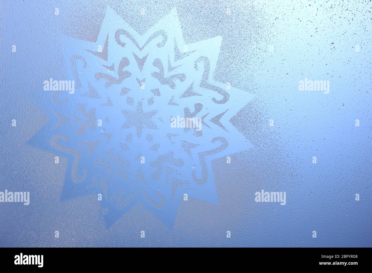 Snowflake pattern on window Stock Photo - Alamy
