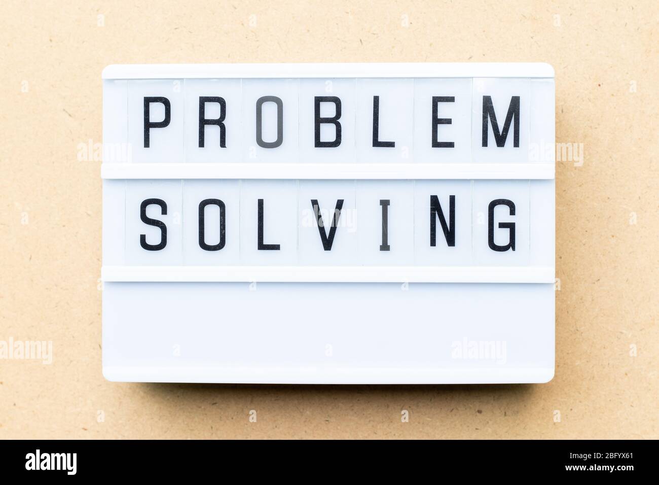 White lightbox with word problem solving on wood background Stock Photo