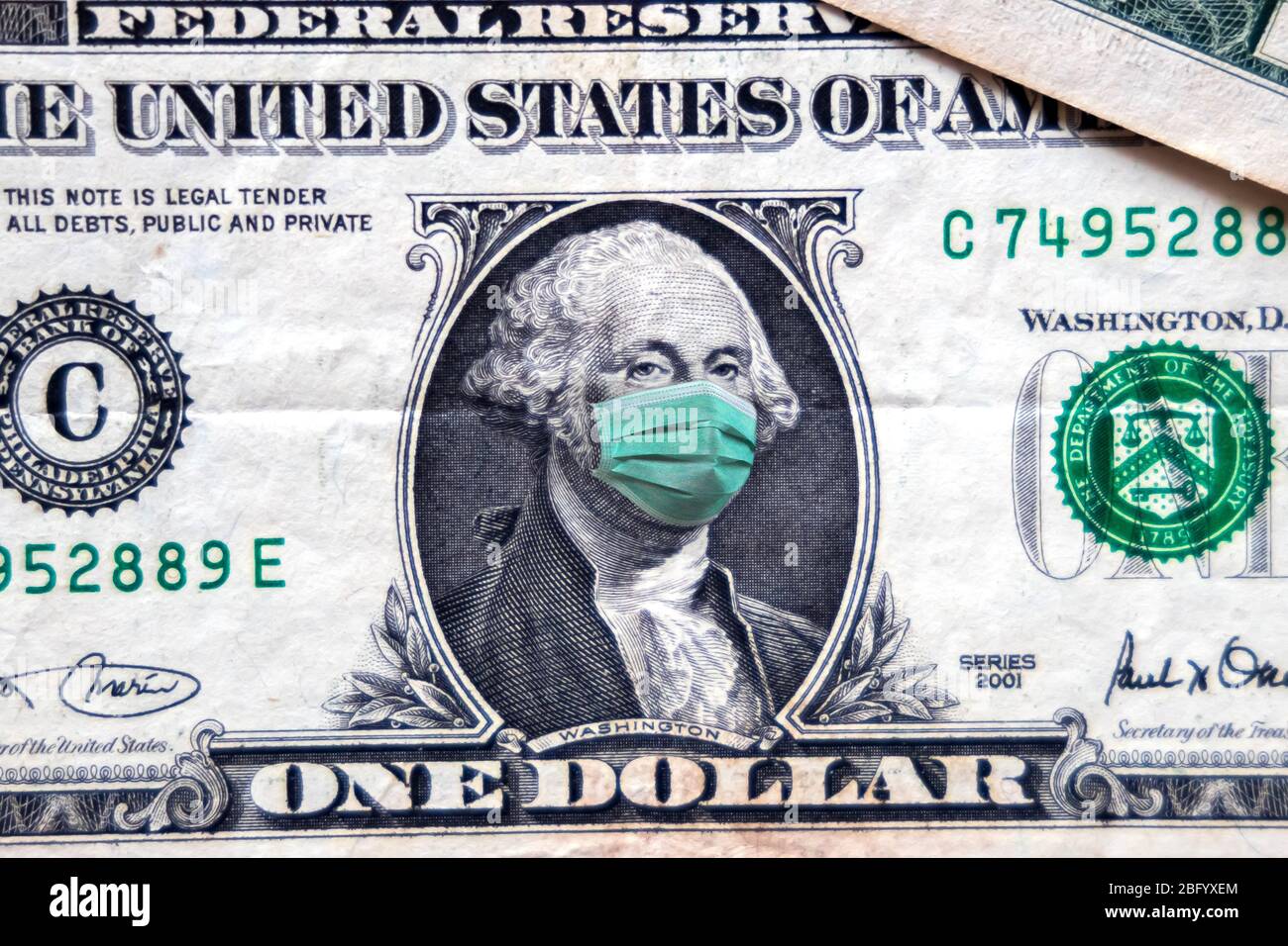COVID-19 coronavirus in USA, 1 dollar money bill with face mask. Coronavirus affects global stock market. World economy hit by corona virus outbreak a Stock Photo